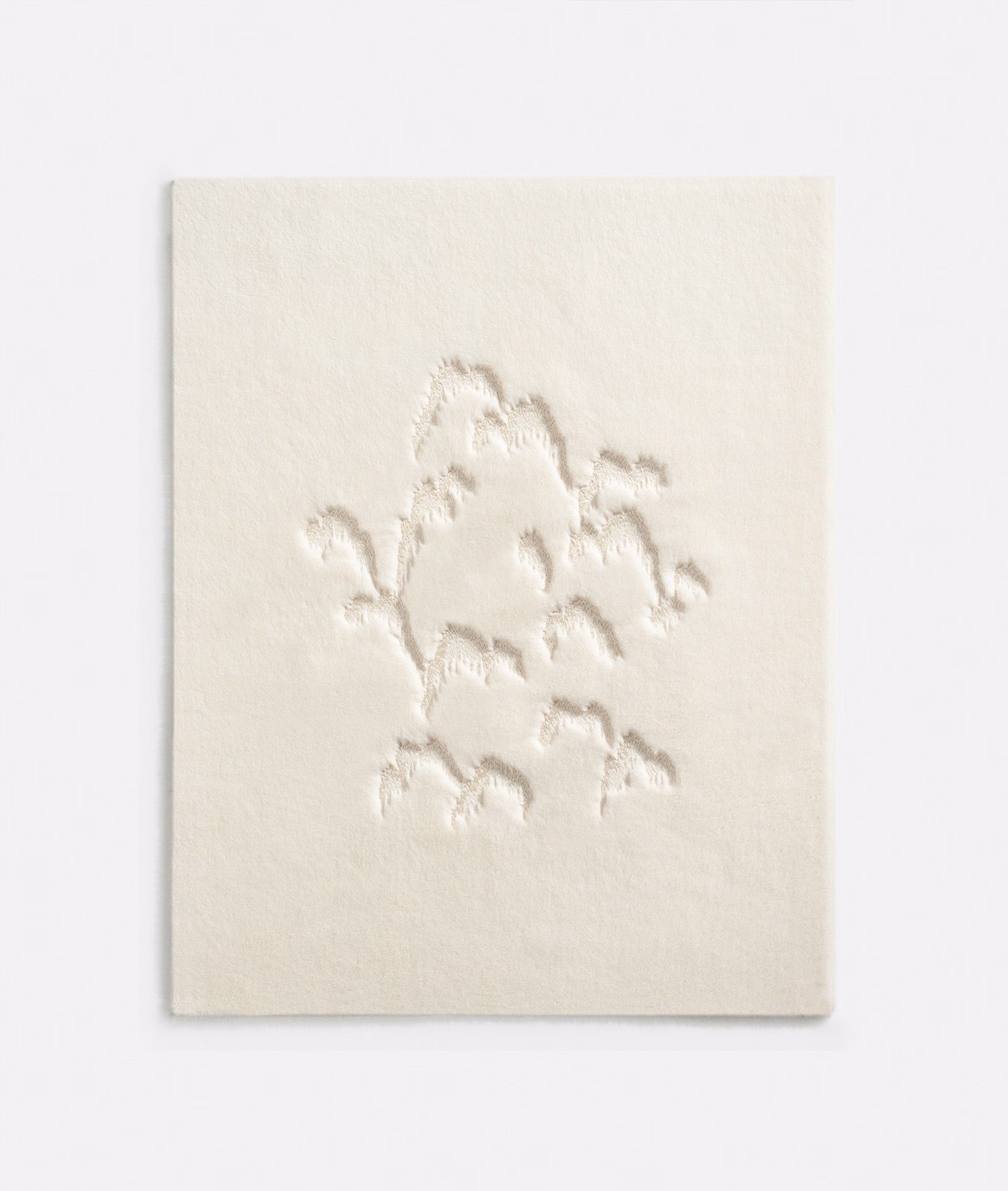 Ivory textile swatch with raised tonal botanical branches on a softly textured ground