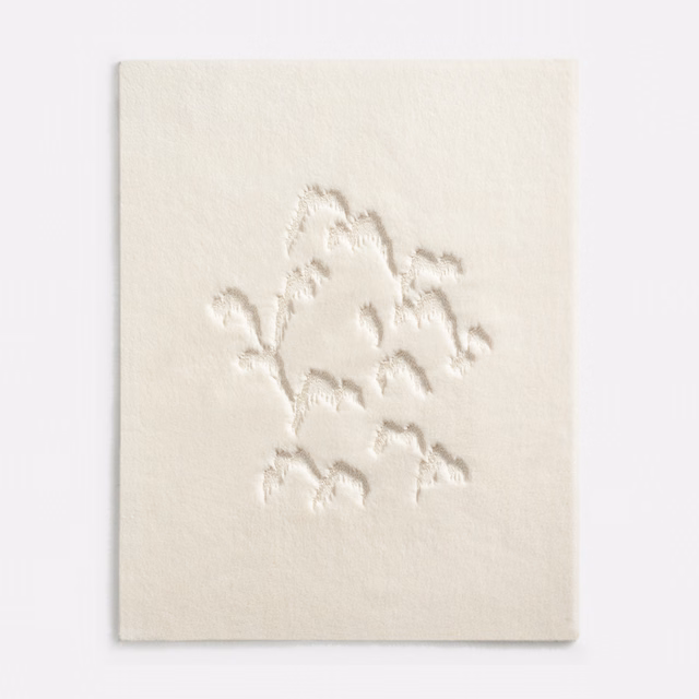 Ivory textile swatch with raised tonal botanical branches on a softly textured ground