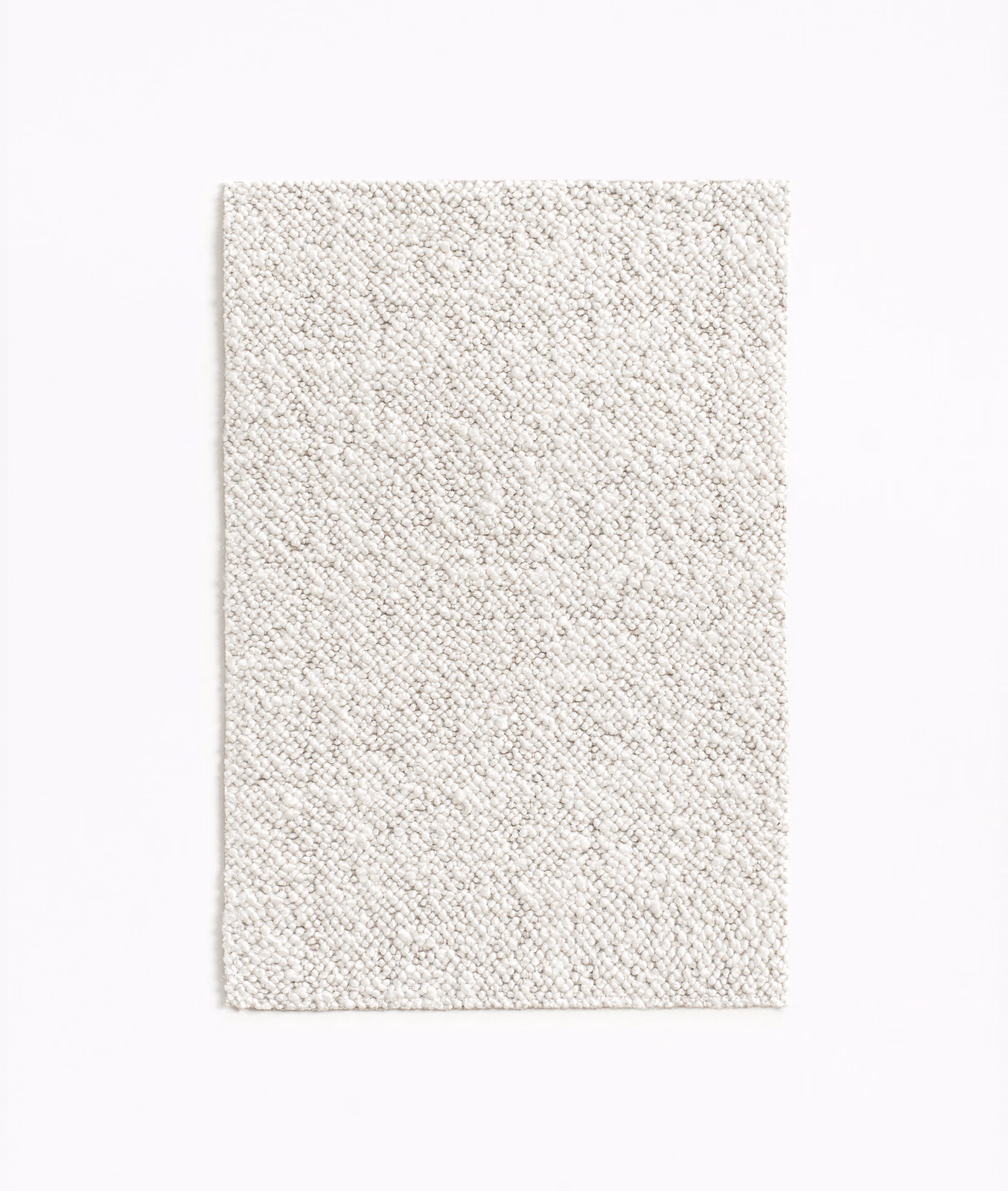 Pale ivory upholstery fabric with a fine, nubby looped texture