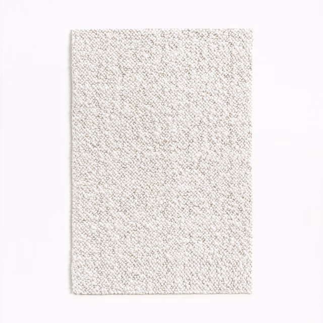 Pale ivory upholstery fabric with a fine, nubby looped texture