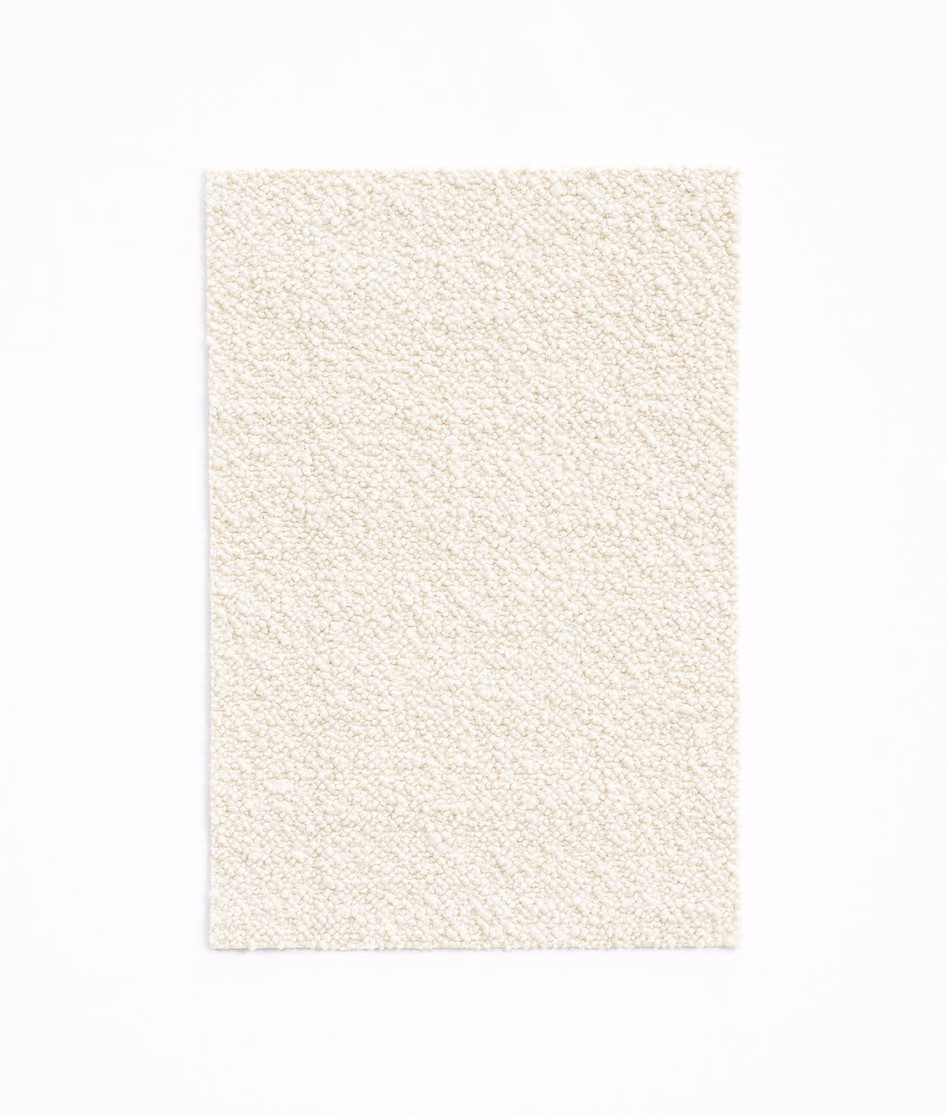 Close view of warm ivory fabric with a fine, irregular nubby weave