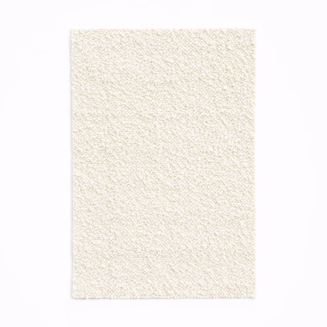 Close view of warm ivory fabric with a fine, irregular nubby weave