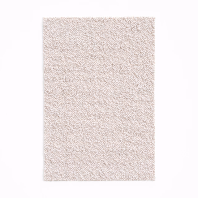 Pale blush-pink textile swatch with a dense, softly looped nubby texture