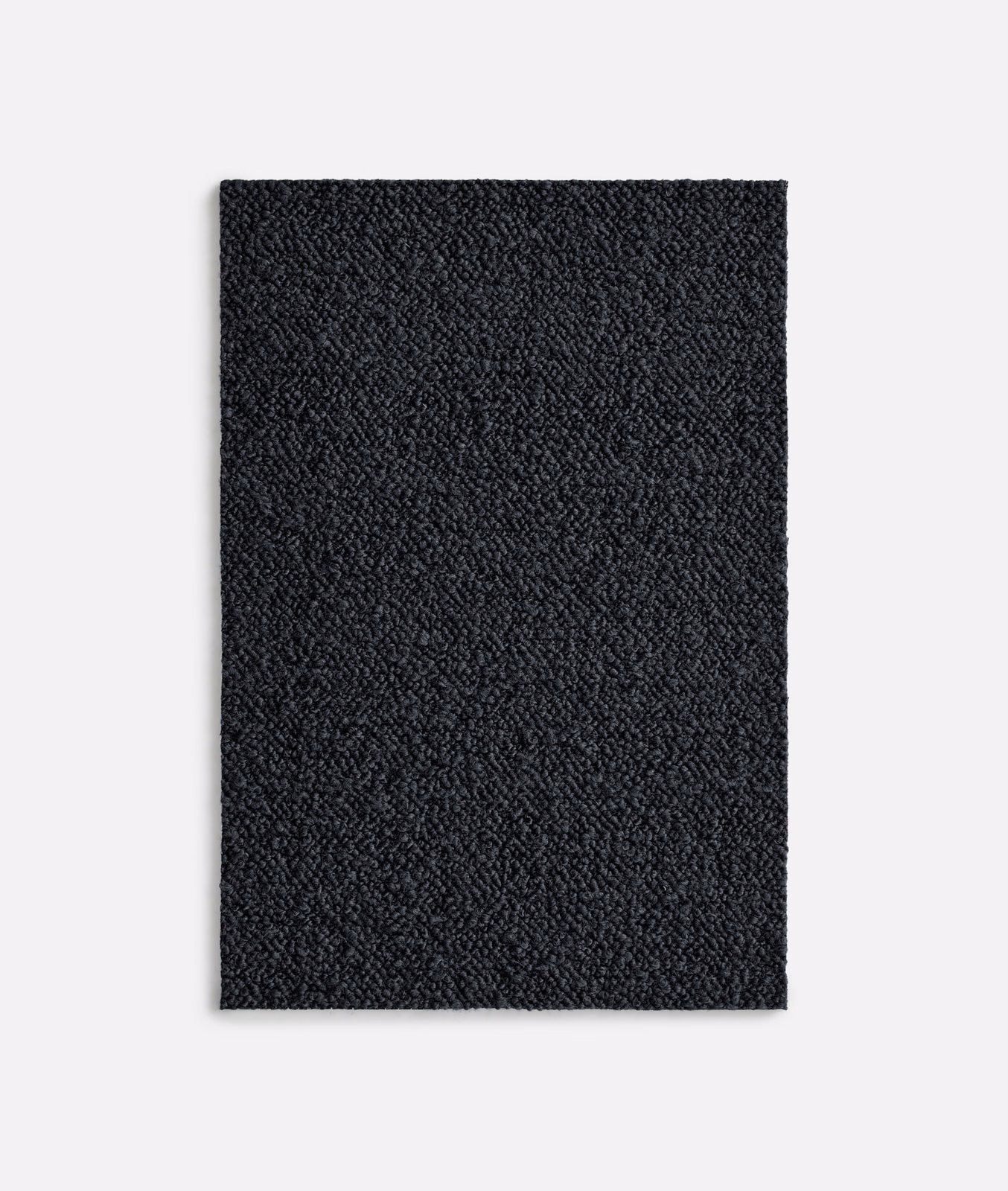 Near-black nubby textile swatch with subtle charcoal highlights and compact woven texture