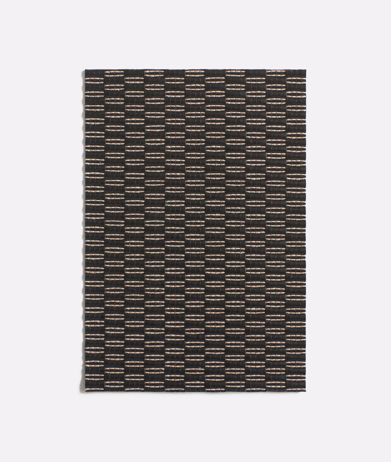 Charcoal black woven fabric with warm taupe flecks in vertical geometric columns