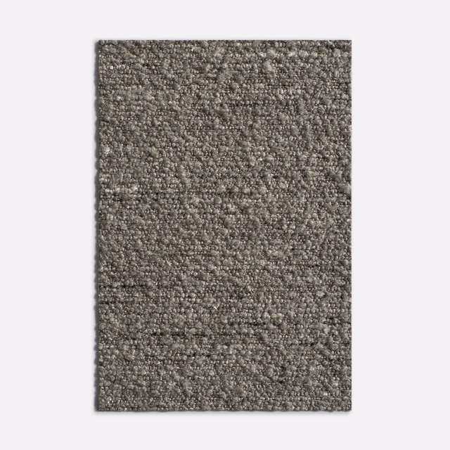 Mottled clay-taupe Lamberto Argilla showing a dense, nubby woven texture