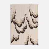 Pale lilac woven upholstery swatch with charcoal abstract lava-like sweeping motifs