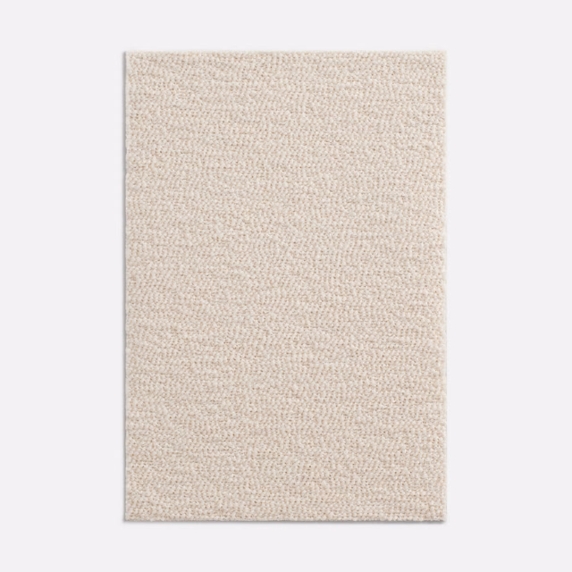Warm ivory swatch showing a dense, fine looped bouclé texture
