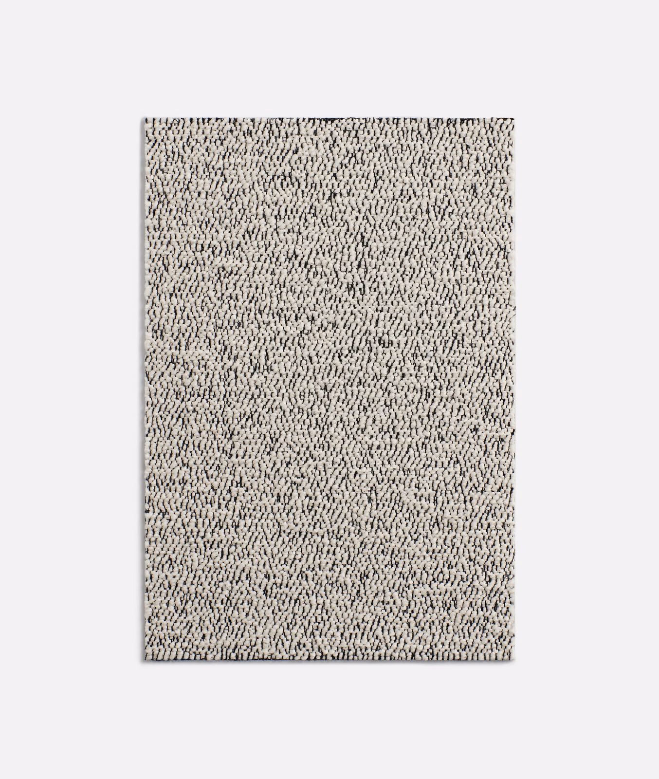 Ivory cream looped upholstery fabric with dense charcoal flecks and a nubby surface