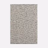 Ivory cream looped upholstery fabric with dense charcoal flecks and a nubby surface