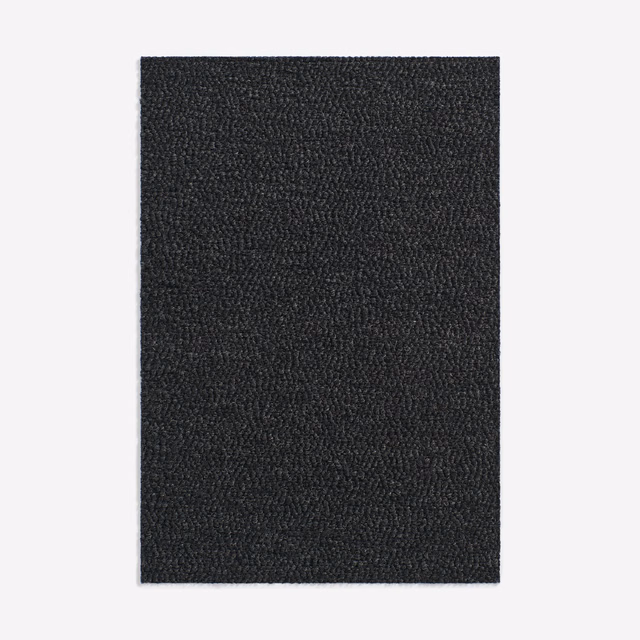 Near-black charcoal upholstery swatch with a dense, finely looped pebbled weave