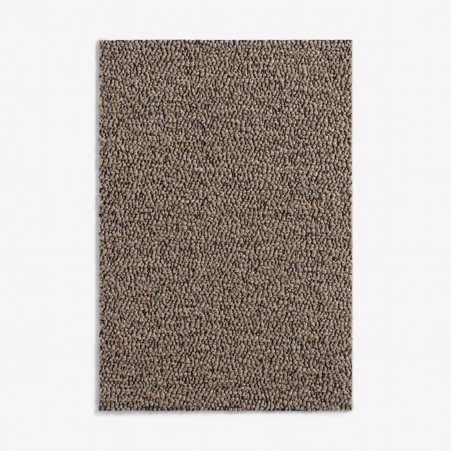 Close view of dense taupe-brown loop texture with subtle light and dark flecks