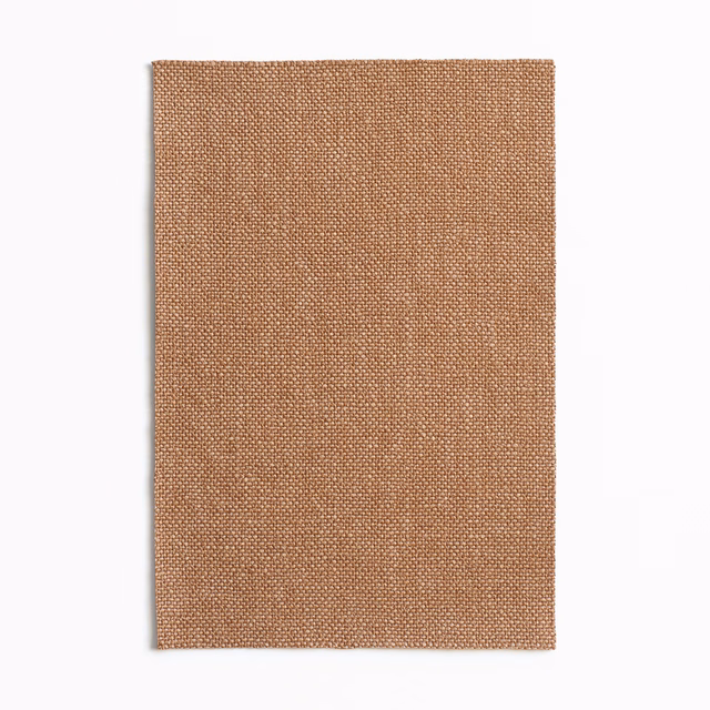 Warm cuoio-tan fabric swatch showing a fine, tightly woven plain texture
