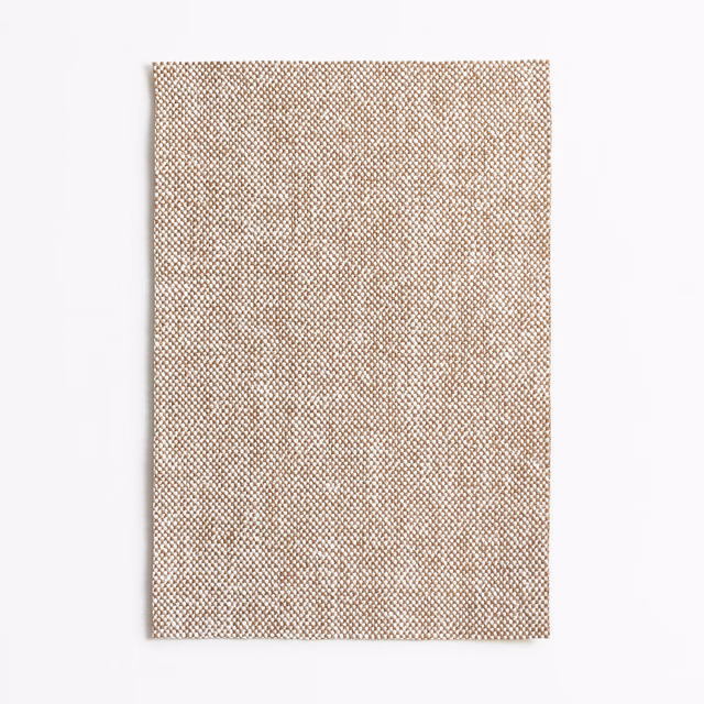 Warm ochre-tan woven upholstery swatch with fine mottled check texture