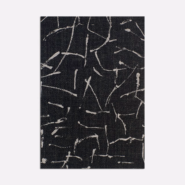 Charcoal-black woven fabric with scattered ivory, map-like linear marks