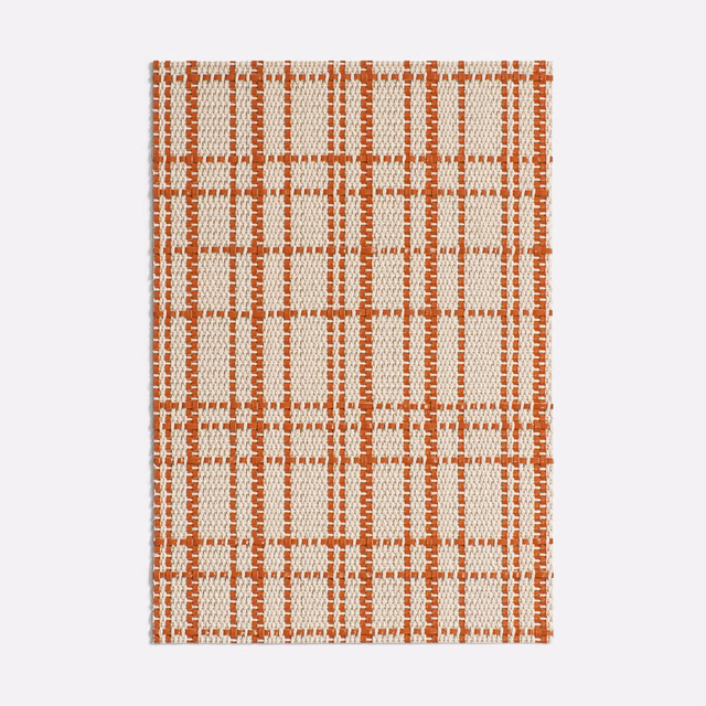 Cream woven swatch with irregular rust-red windowpane checks and tactile texture