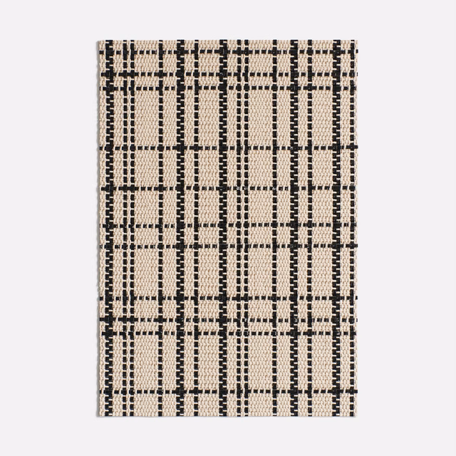 Black and warm cream woven swatch with an irregular, tactile windowpane grid
