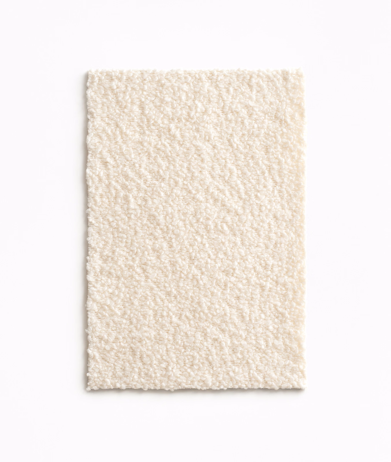 Warm ivory swatch showing a softly raised, irregular looped texture