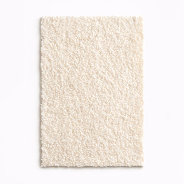 Warm ivory swatch showing a softly raised, irregular looped texture