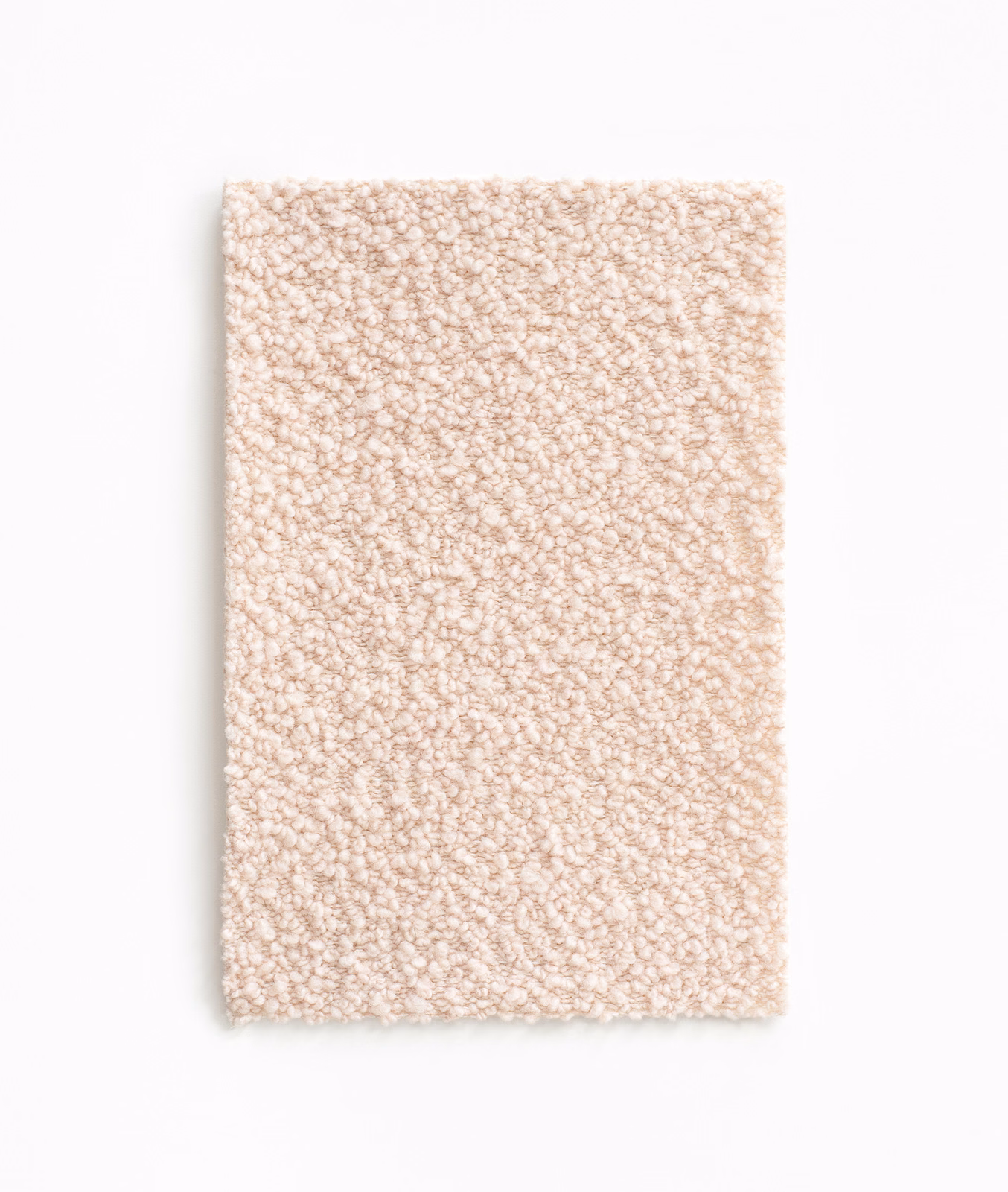 Pale blush-nude upholstery fabric with a dense, softly looped bouclé surface