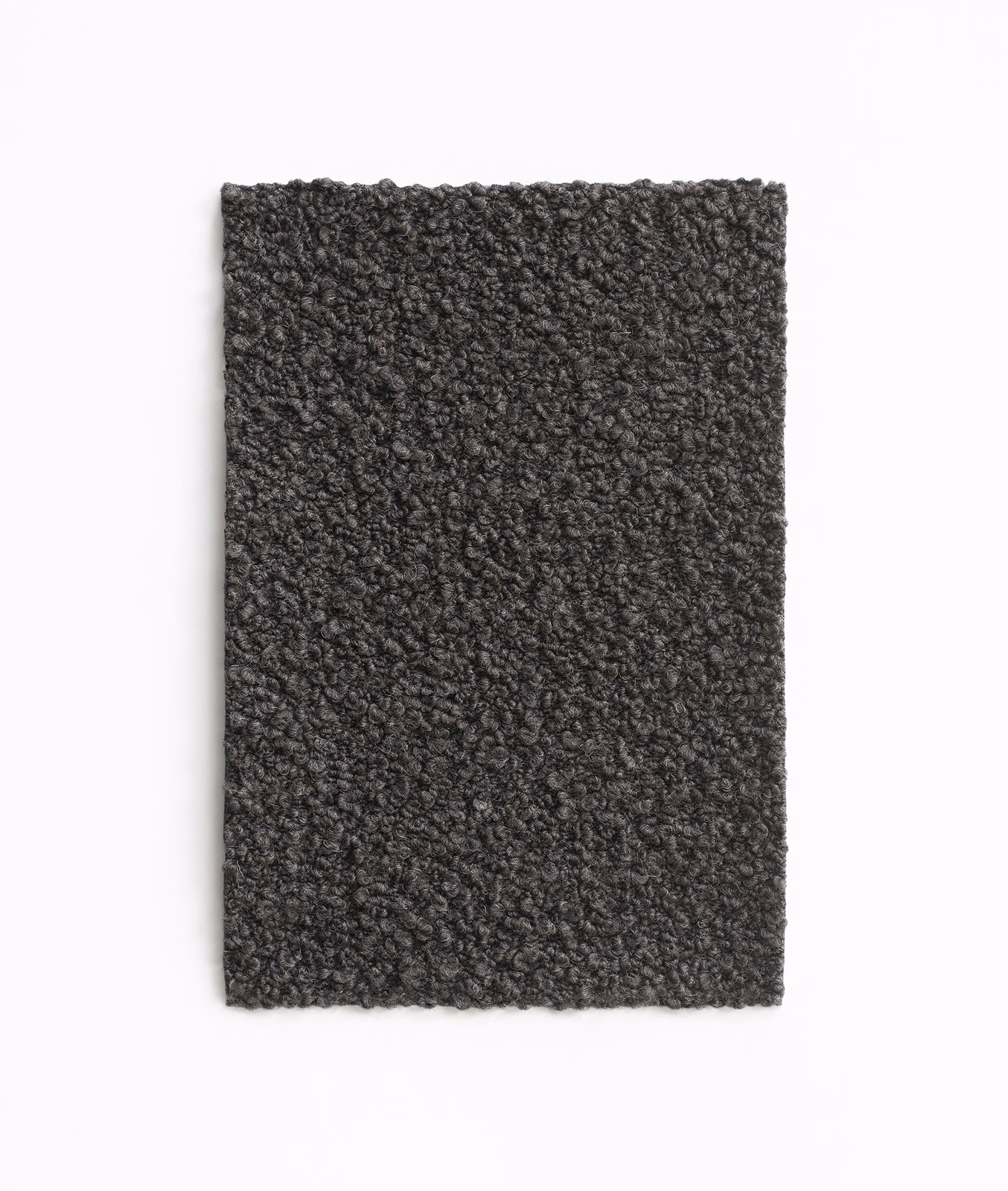 Dark testa di moro brown upholstery swatch with dense charcoal nubby texture