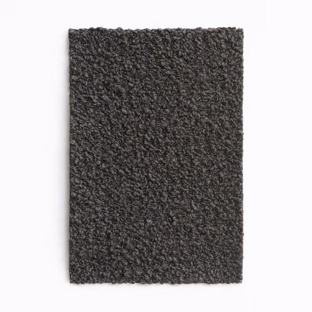 Dark testa di moro brown upholstery swatch with dense charcoal nubby texture