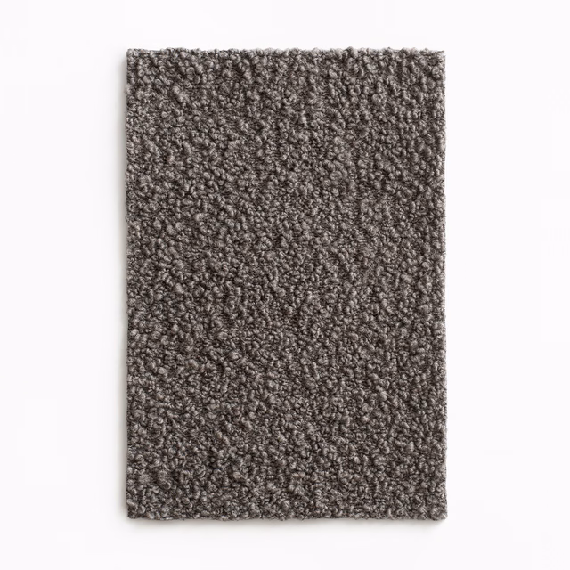 Deep taupe-brown upholstery swatch with dense, irregular looped texture