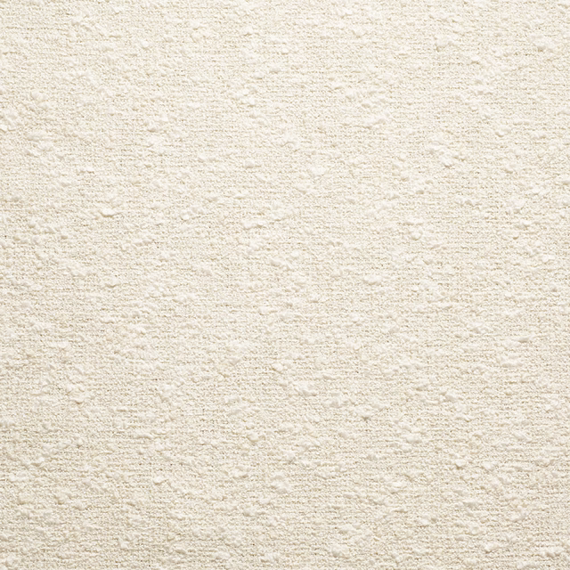 Warm ivory upholstery textile with a softly flecked, tactile woven surface