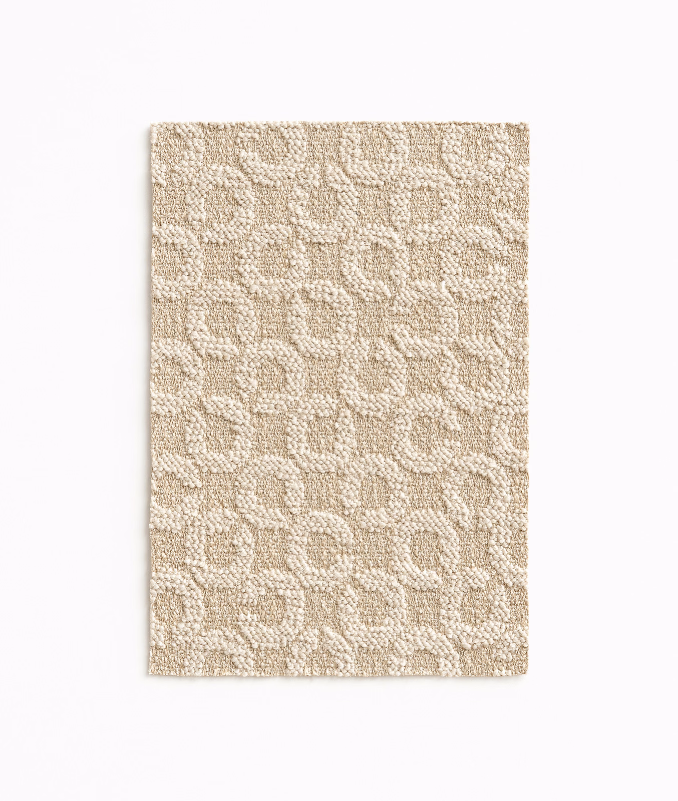 Warm oat-beige woven swatch with raised pebble-like motifs and softly flecked texture