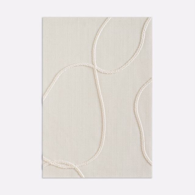 Ivory woven upholstery fabric with raised looping cord lines and fine vertical texture