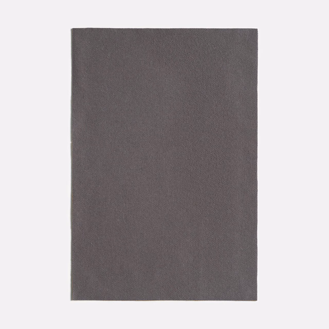 Dark antracite-grey fabric swatch with a fine, softly mottled surface