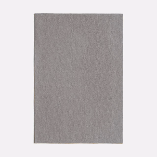 Muted taupe-grey plain fabric swatch with a fine, softly mottled woven texture