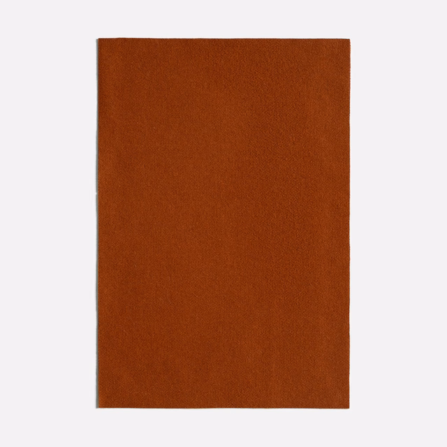 Deep reddish-brown plain fabric swatch with a fine, subtly varied woven surface
