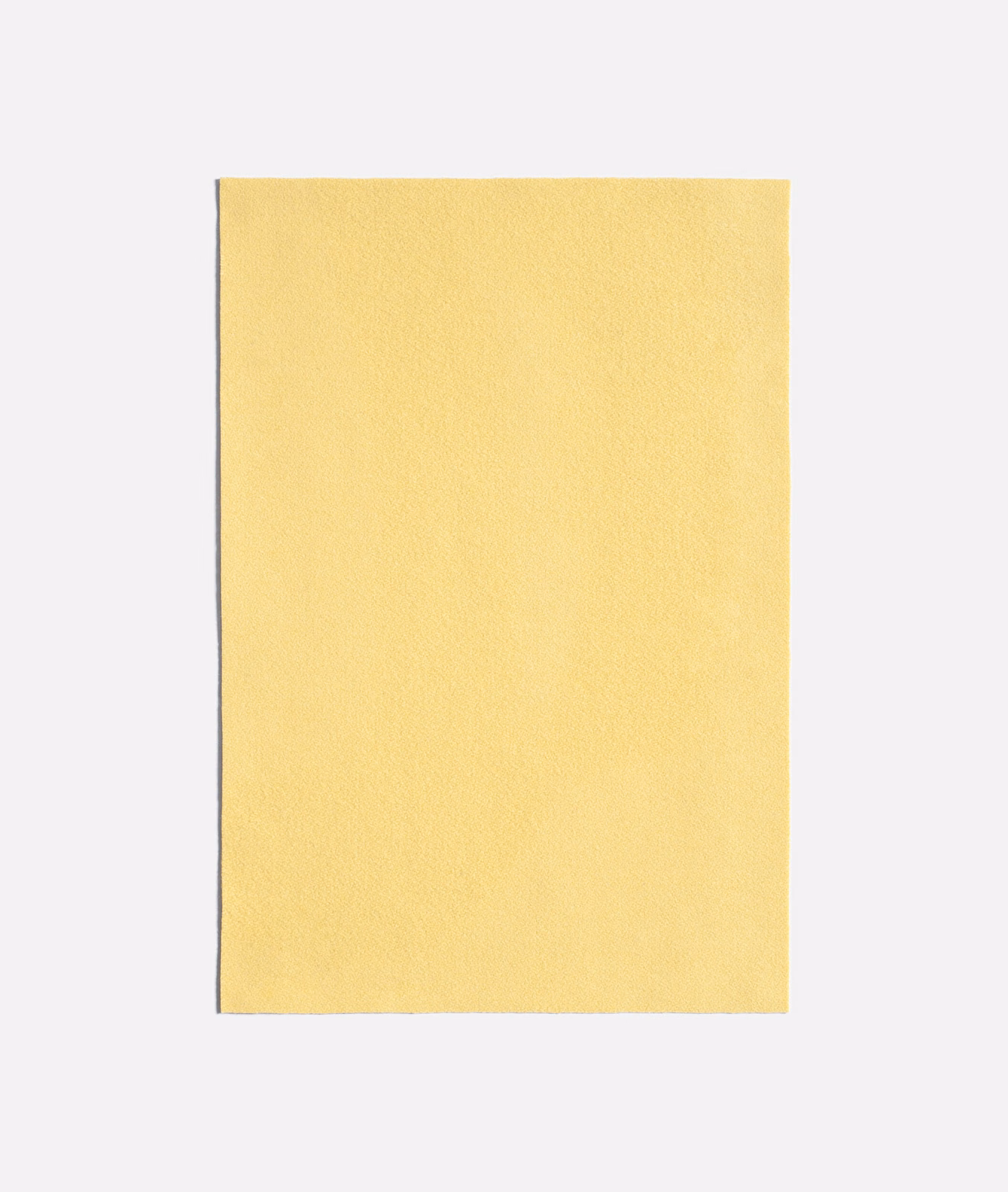 Pale canary-yellow fabric with a fine, softly textured plain surface