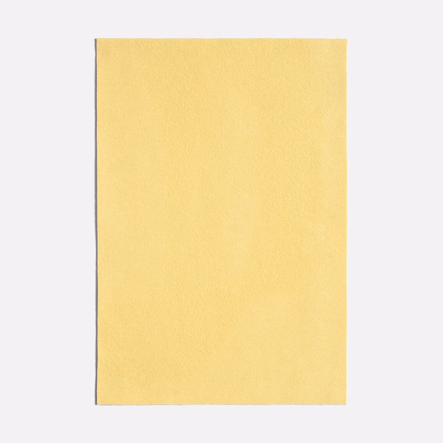 Pale canary-yellow fabric with a fine, softly textured plain surface