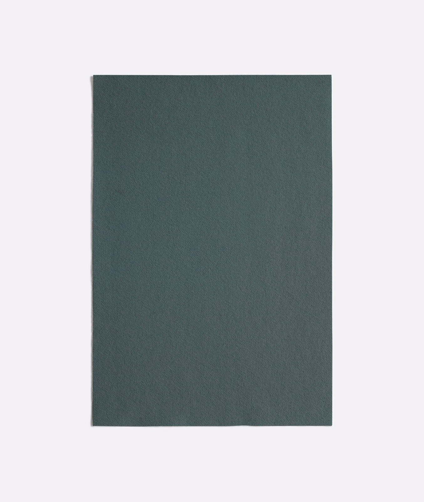 Deep celadon green upholstery swatch with a softly textured, matte surface