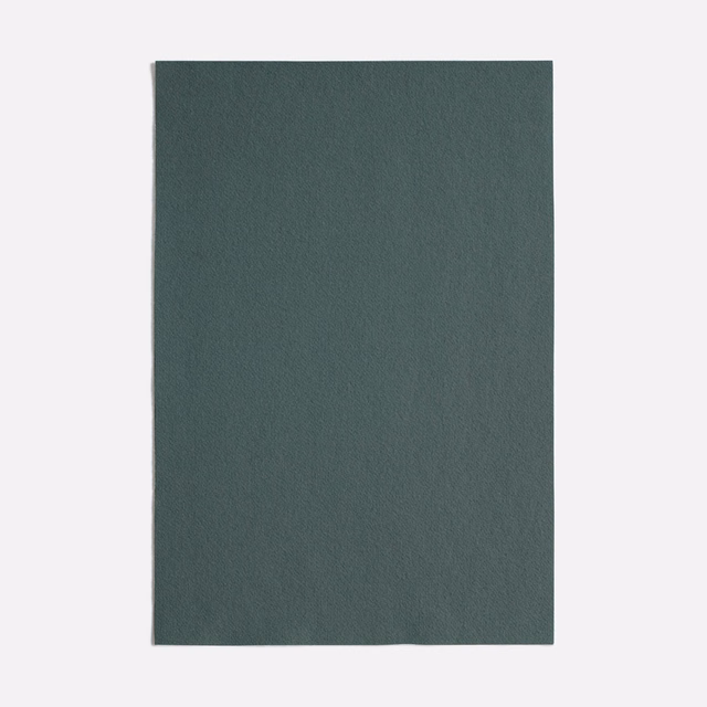 Deep celadon green upholstery swatch with a softly textured, matte surface