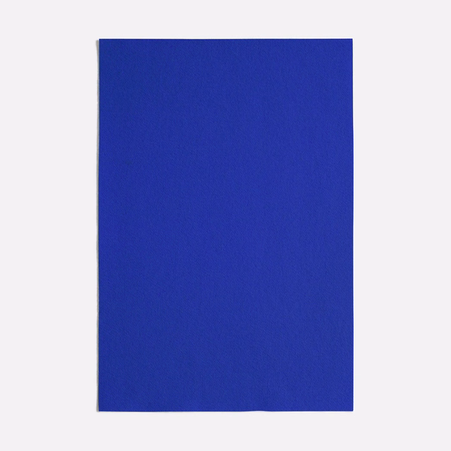 Close view of a saturated cobalt-blue woven textile with a quiet matte texture