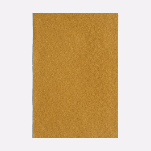 Warm cumin-ochre plain fabric with a fine, subtly textured matte weave