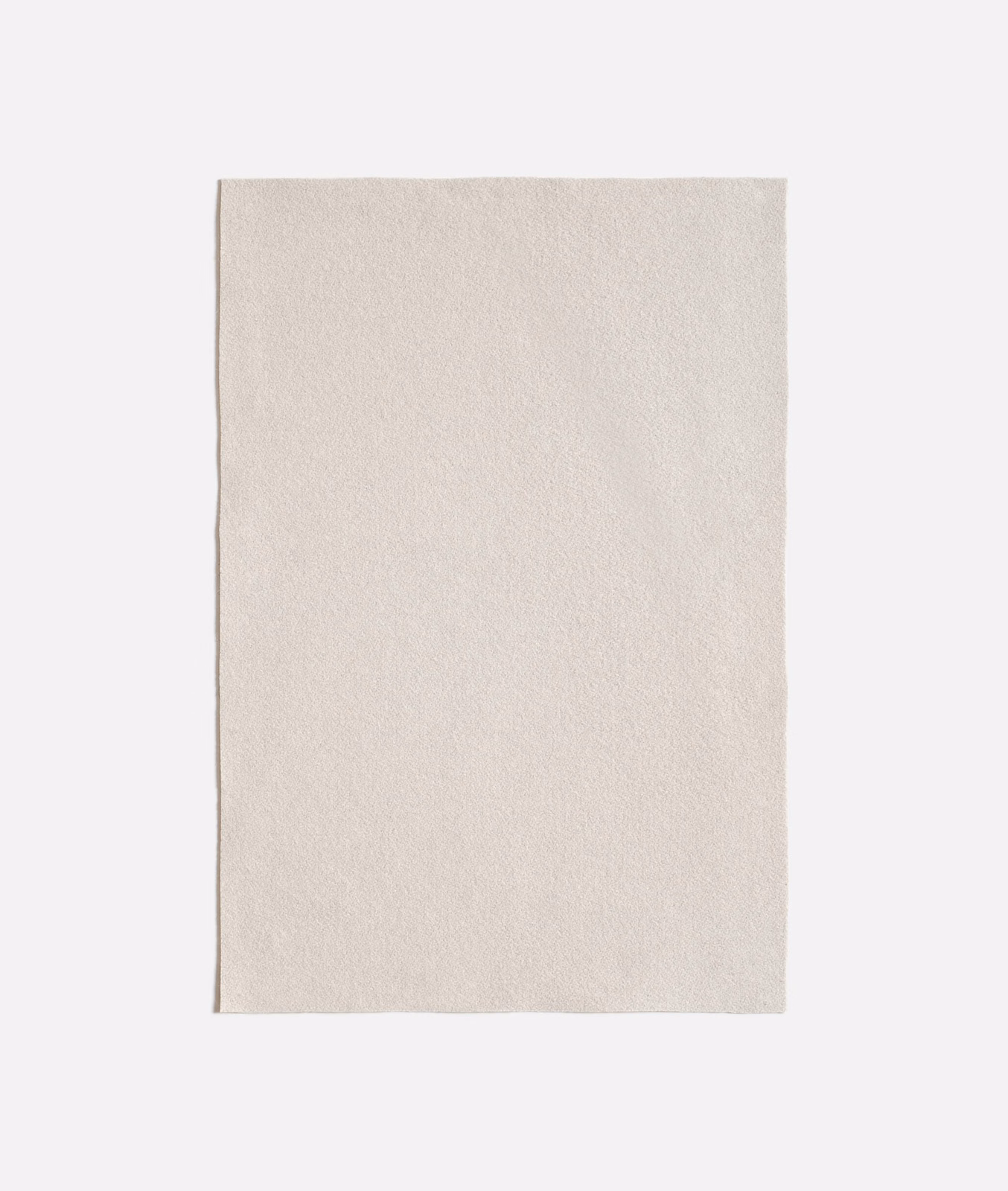 Pale natural-ivory Queneau Naturale swatch with a soft, fine-grained surface