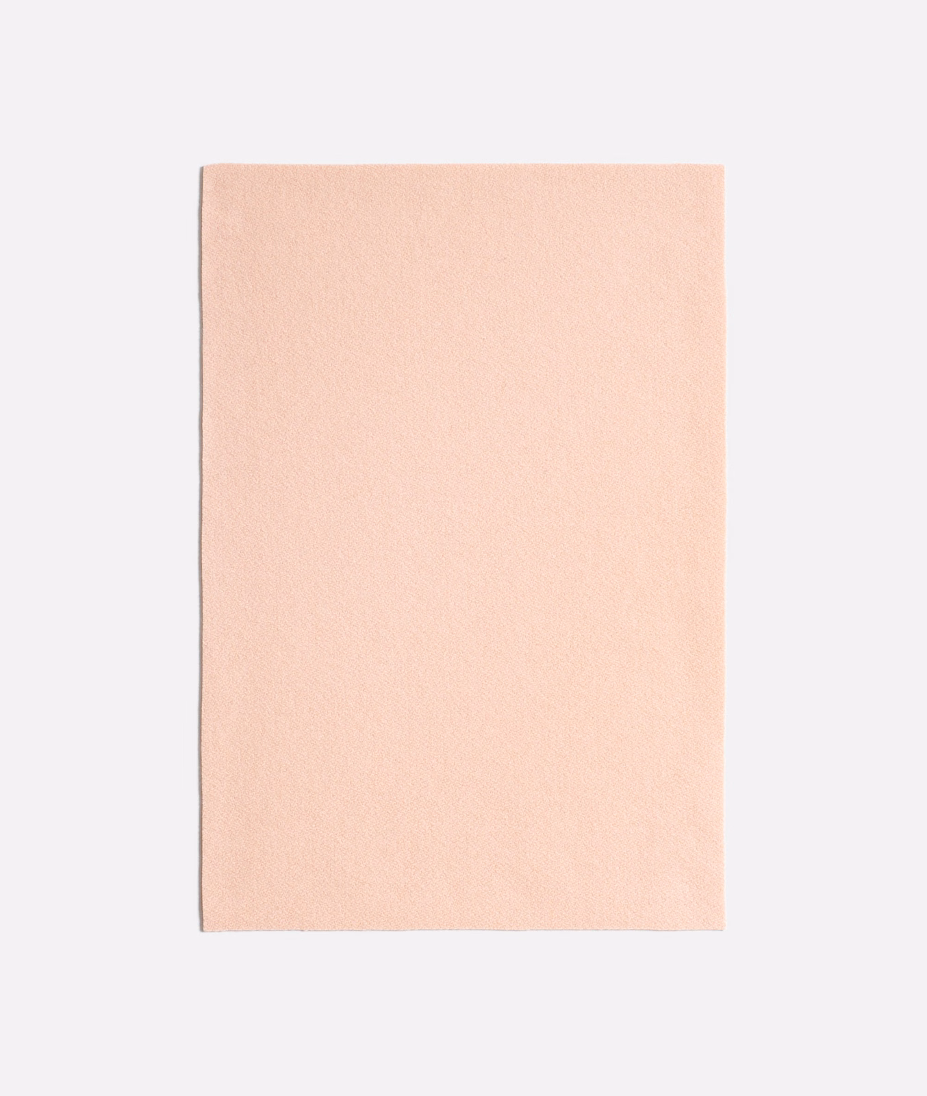 Pale blush pink Queneau Peonia fabric with a softly textured plain surface