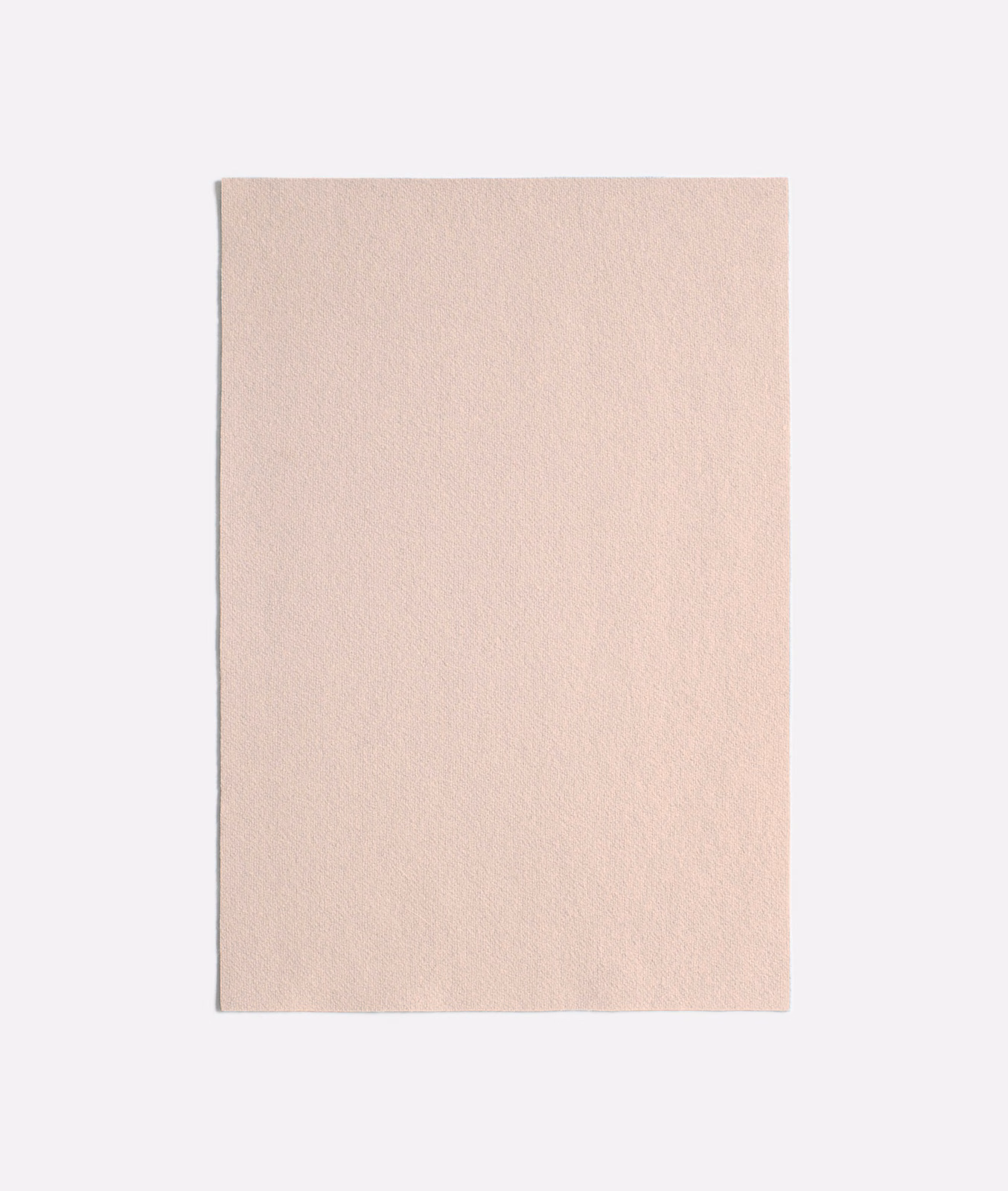 Pale blush pink swatch with a softly mottled, matte textile surface