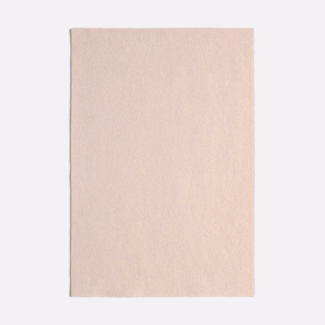 Pale blush pink swatch with a softly mottled, matte textile surface