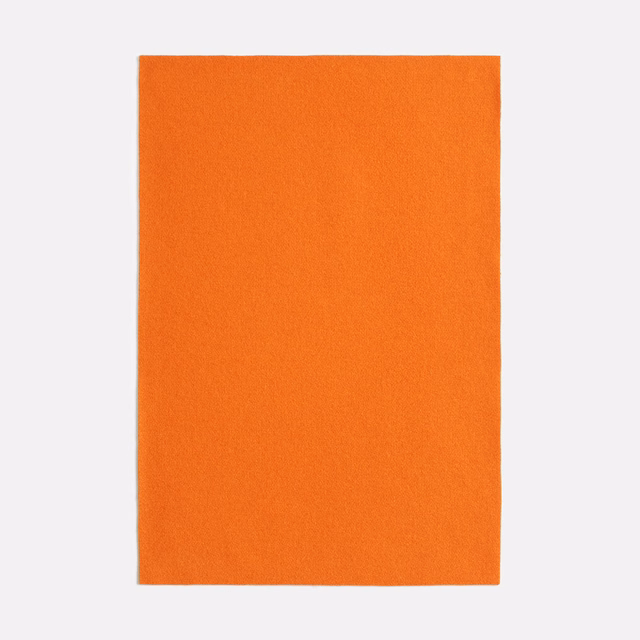 Saturated pumpkin-orange plain textile with a softly brushed, even surface
