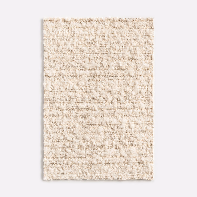 Warm ivory-beige nubby weave with irregular horizontal flecks and tactile surface