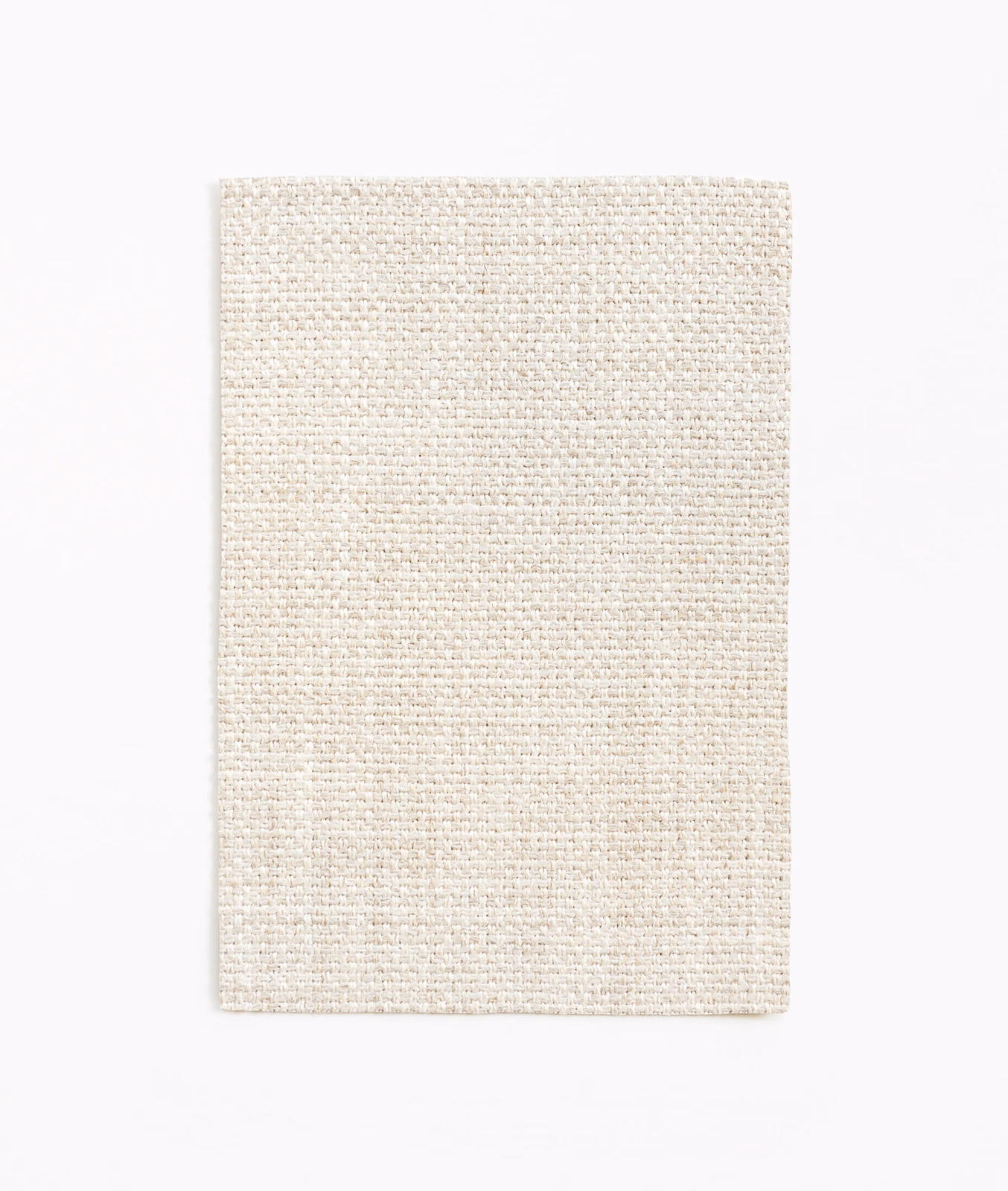 Pale chalk ivory fabric swatch with a dense, subtly flecked woven texture