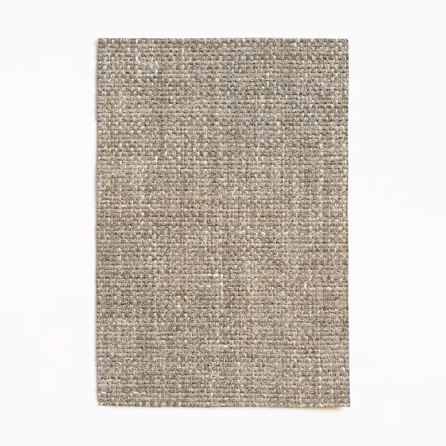 Mottled taupe-grey woven upholstery swatch with a dense tactile texture