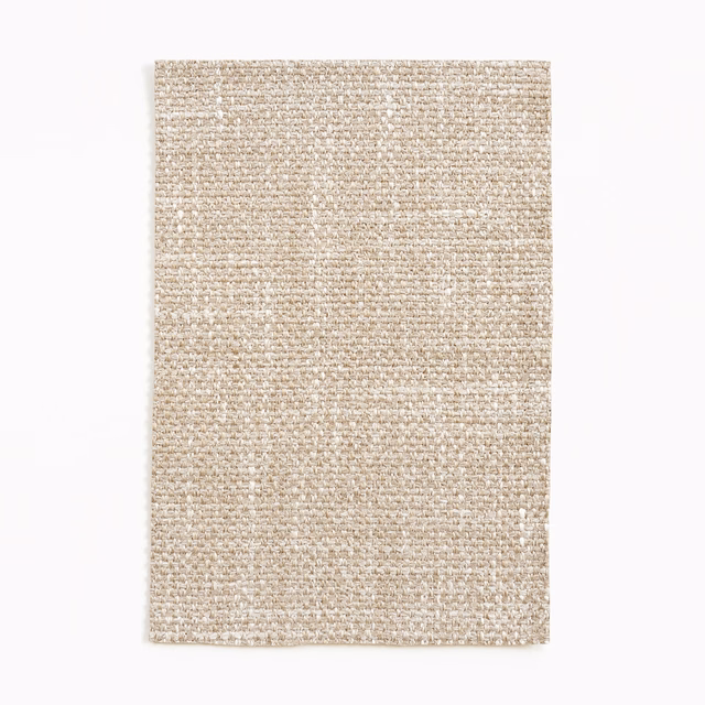 Warm oatmeal-beige textile swatch with a nubby, softly flecked woven surface