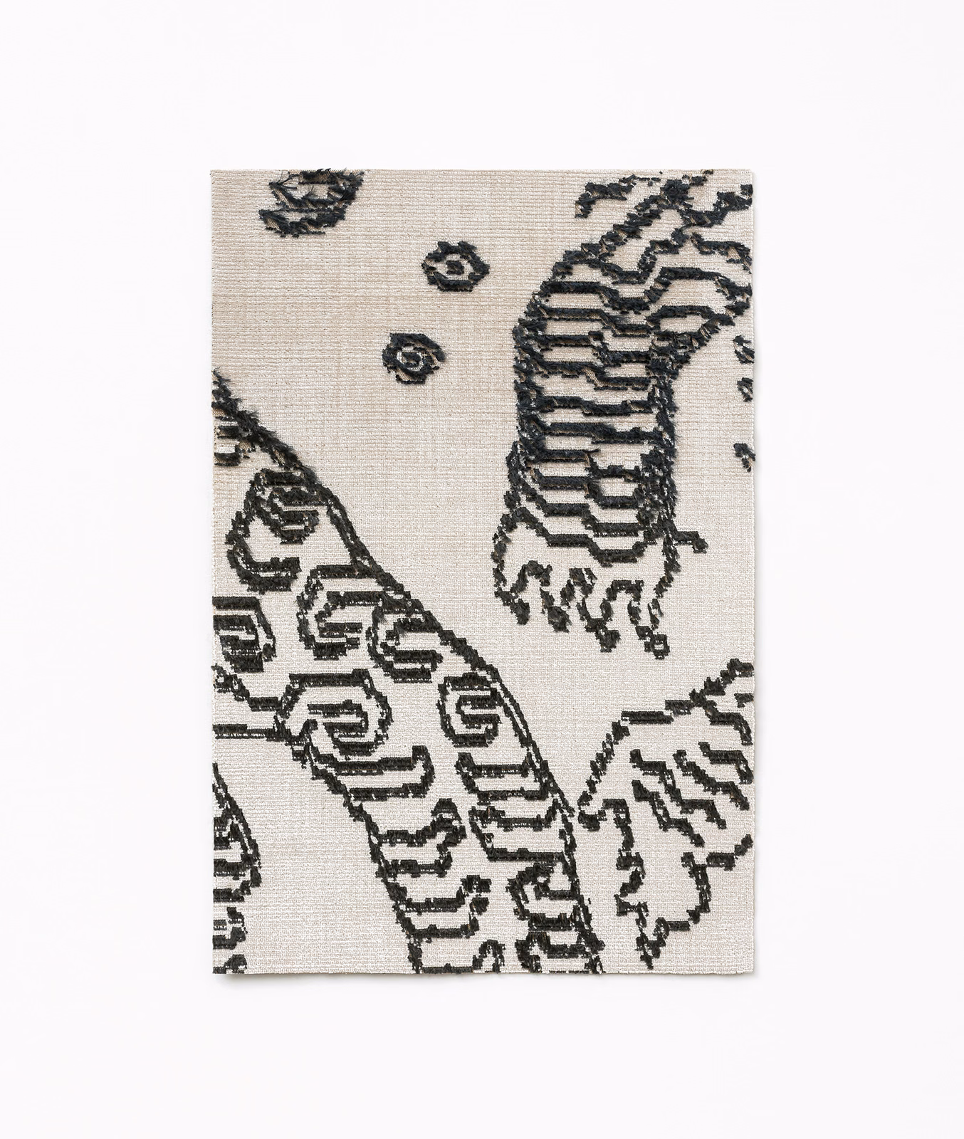 Ivory woven textile with graphite tiger-stripe motifs and small circular marks