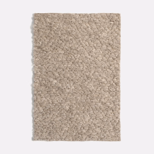 Warm greige taupe fabric swatch with dense irregular nubby loops and mottled depth